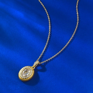 Vintage oval gold-plated silver necklace with brushed finish and crystal pendant