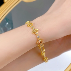 Detailed close-up of S925 silver iris flower bracelet with vintage brushed gold texture