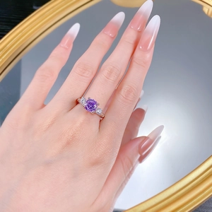 Detailed view of an S925 silver ring featuring an 8mm purple zircon in a three-stone design
