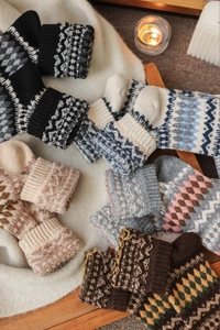 Close-up of thick Fair Isle wool socks with vintage jacquard patterns for winter