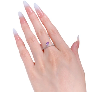Elegant S925 sterling silver ring with pear cut purple gemstone on a finger