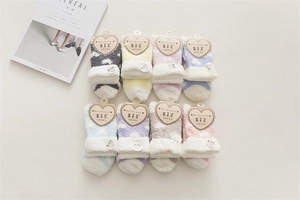 Set of eight pairs of thick coral fleece heart socks in soft pastel macaron colors
