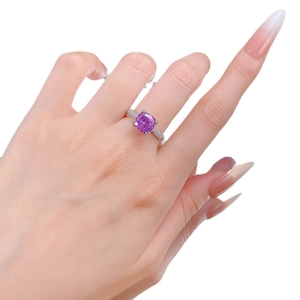 Lavender purple radiant cut silver ring with white zircon halo on female hand