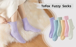 Close-up of cozy coral fleece socks in multiple colors with elastic cuff detail
