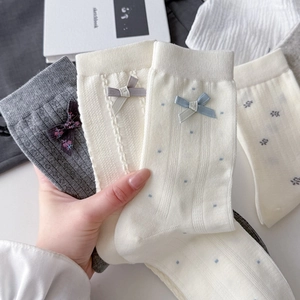 Japanese style cotton crew socks with sweet bow accents in grey and cream colors