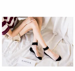 Detailed shot of black floral lace trim socks for women in stylish French Lolita style