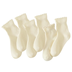 Detail showing six pairs of cream white socks with lace trim and vertical rib knit texture