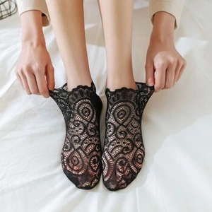 Elastic black lace no-show socks featuring intricate patterns and scallop edges