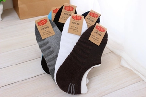 Detail of multi-color low cut socks with non-slip silicone and soft towel bottom texture