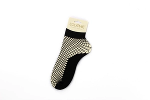 Close-up of black hollow-out fishnet ankle socks with reinforced toe and heel details