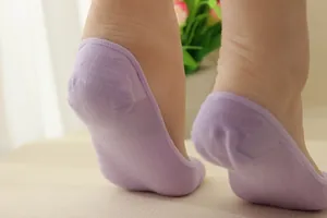 Close-up of light purple aloe fiber open-toe socks with non-slip heel fit on foot