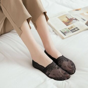 Close-up of black floral lace invisible boat socks showing fine mesh texture and patterns