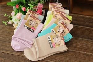 Close-up of colorful non-slip cotton socks with rolled edge for elderly and maternity