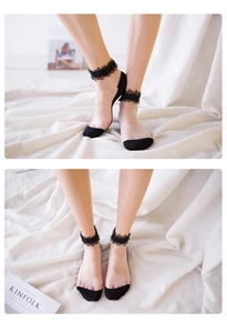 Detailed view of sheer black invisible socks with elegant 3D embroidered lace trim