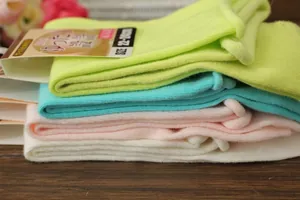 Close-up of ribbed cotton socks in pastel colors with high elasticity and 22-24cm size tag