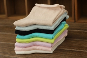 Close-up of colorful 200-needle combed cotton socks with comfortable rolled cuffs