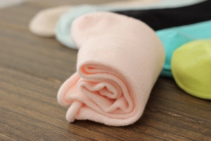 Detailed macro view of high-quality combed cotton socks with soft texture and rolled edges