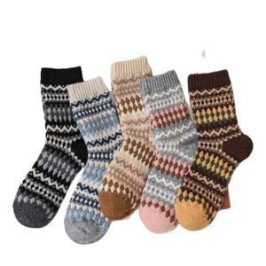 Five pairs of vintage Nordic wool socks with Fair Isle diamond patterns for winter warmth