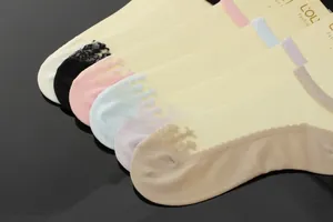 Close-up of thin invisible boat socks for women featuring crown lace jacquard details