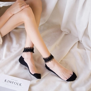 Elegant black lace trim low cut crystal socks displayed on a soft ivory fabric background