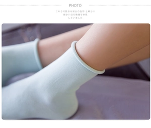 Detail of light blue rolled cuff women's socks in soft combed cotton fabric