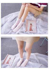 Detail view of light pink combed cotton socks with a comfortable rolled edge design