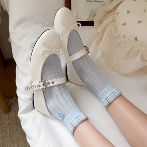Chic Mary Jane flats in creamy white with bow detail and bird embroidery mesh socks