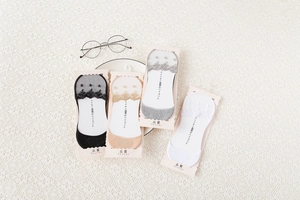 Detailed set of four lace invisible socks in black, nude, grey, and white colors