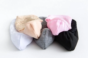 Detailed close-up of five pairs of assorted lace mesh no-show socks in various colors