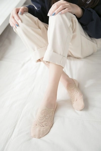 Close-up of floral lace invisible socks in beige with non-slip grip and breathable mesh