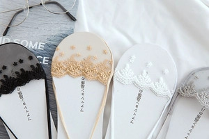 Detail of 3D lace floral patterns on seamless no-show ice silk socks in four colors