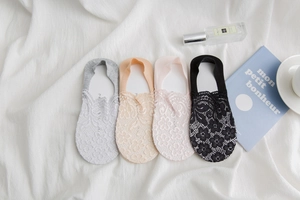 Close-up of elegant floral lace invisible socks in grey, beige, pink and black colors