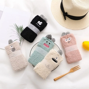 Five pairs of thick coral fleece animal socks with cute cartoon eyes in pastel colors