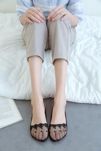 Detail of thin mesh and floral lace patchwork on low cut no-show invisible socks
