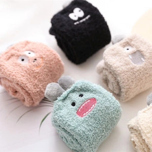 Thick coral fleece socks with cute cartoon monster faces in multiple pastel colors