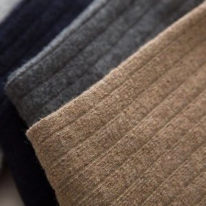 Thick wool business socks for men in navy, grey and camel colors with ribbed knit texture