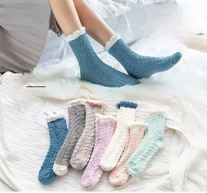 Thick coral fleece sleep socks with soft plush trim in various pastel colors