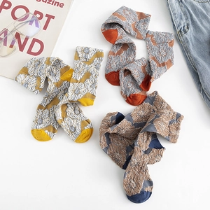 Three pairs of vintage floral crew socks with embossed jacquard and contrasting colors