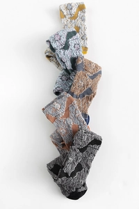 Detail of vintage Japanese style socks featuring 3D floral texture and retro color palette