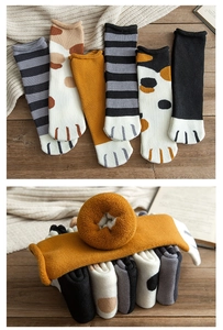 Close-up of thick thermal cat claw socks showing soft knit texture and warm inner lining