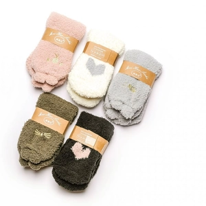 Detailed view of colorful coral fleece socks with cute cat embroidery and packaging