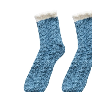 Thick coral fleece thermal socks with blue and white fuzzy cuffs and cable knit pattern