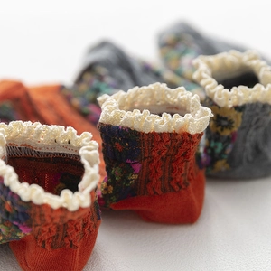 Floral knit socks for women featuring elegant white lace edges and vintage patterns