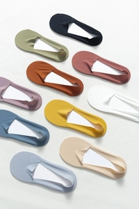 Flat lay of seamless ice silk invisible socks in nine assorted pastel and neutral colors