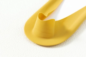 Close-up of seamless ice silk fabric edge showing smooth texture and elastic finish
