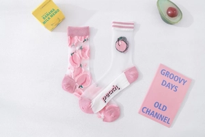 Detail of peach embroidered mesh socks with cute fruit pattern and transparent texture