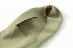 Detail of light green no-show sock featuring seamless edges and cushioned terry sole