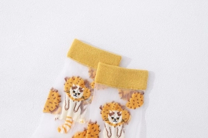 Detail of sheer white mesh mid-calf socks with cute cartoon lion and yellow ribbed cuff