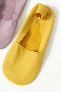 Detail of ice silk invisible socks in yellow and purple showing smooth reinforced seams