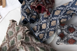 Detail of vintage textured crew socks with ruffle cuffs and baroque jacquard pattern
